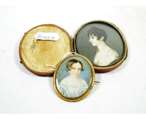 English School (early 19th century): A Miniature Bust Portrait of a Young Boy, wearing a blue chemise, 6cm by 4cm, in a gilt 