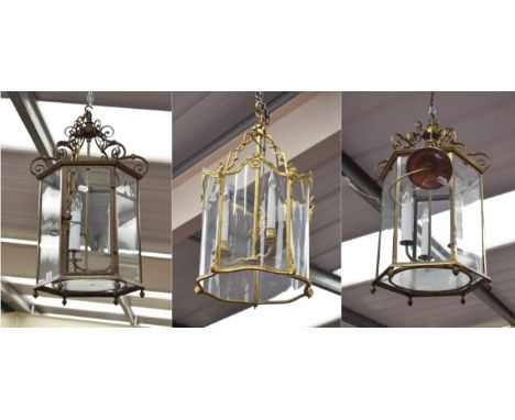 ~ A Pair of Regency Style Brass Hexagonal Hall Lanterns, 65cm; and a Regency Style Gilt Metal Lantern, with three candle arms