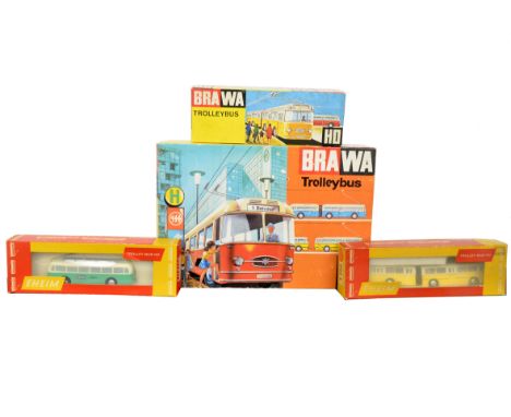 Eheim/Brawa HO Scale Trolleybuses, Nr.6104 Articulated Trolleybus, red/white, Nr.6100B 2-Axle Trolleybus Kit, yellow/white, i