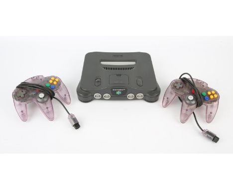 Nintendo 64 (N64) Console + 2 clear purple controllers & power supply Condition Report:  Items are all loose and in good cond