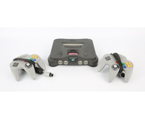 Nintendo 64 (N64) Console + 2 grey controllers & power supply Condition Report:  All items are loose and in used condition. 