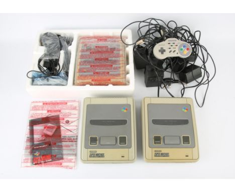 A boxed Super Nintendo System (SNES) + a selection of loose accessories and cables for Super Nintendo systems This lot also i