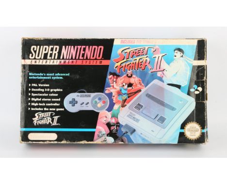 Super Nintendo System (SNES) Street Fighter 2 Edition (PAL) Condition Report:  Item is CIB and in used condition. There is si