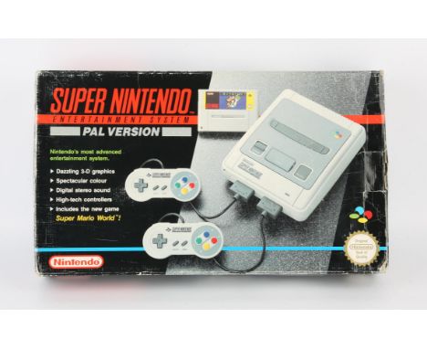 Super Nintendo System (SNES) Super Mario World Set (PAL) Condition Report:  Item is CIB and in good condition. There is some 