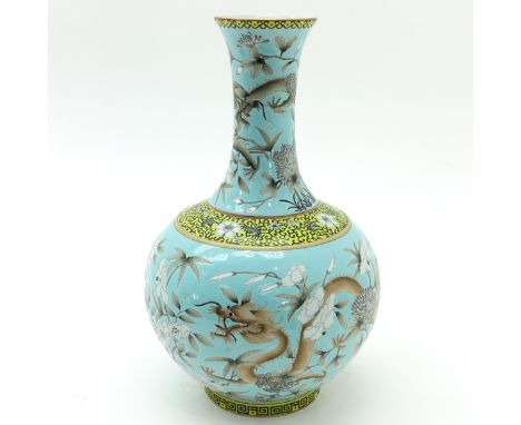 Light blue ground with dark and light grey enamels depicting dragons and florals, Guangxu mark, 38 cm. tall. 