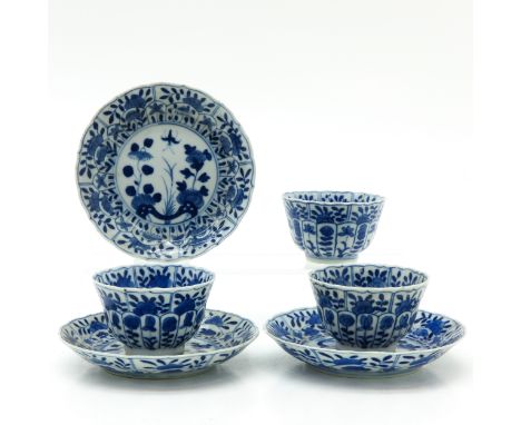 Blue and white floral decor, cups and saucers with salloped edge, 18th Century, marked with double ring and jade symbol, sauc
