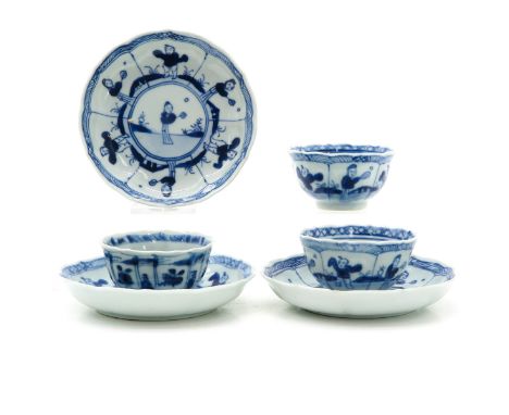 Blue and white decor depicting Chinese figures, saucers are 12 cm. in diameter.