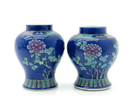 Blue ground with Famille Rose floral enamels, marked with double ring, 16 cm. tall, one with hairline.