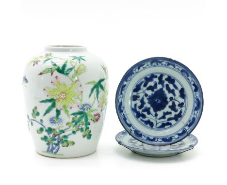 Vase decorated in Famille Rose floral enamels, two small plates in blue and white floral decor, vase is 17 cm. tall and marke