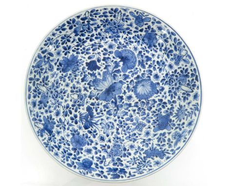 Floral decor, 18th Century, marked with double ring and Artemisia leaf, 39 cm. in diameter, with restorations.