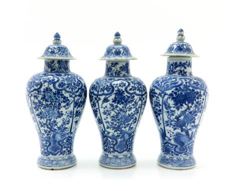 Blue and white floral decor, Kangxi Period, marked with double ring and flower, 29 cm. tall, in diverse conditions.