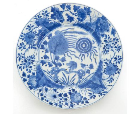 Depicting scene in garden with butterflies and flowers, marked with double ring and censer, 27 cm. in diameter, chips on edge