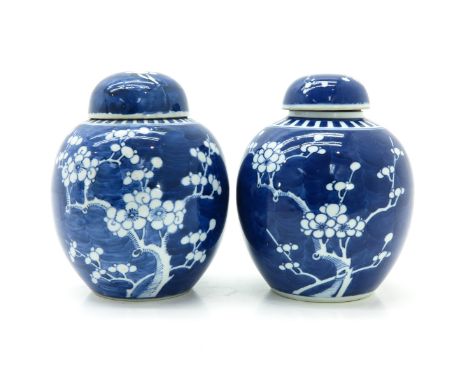 Dark blue ground with white flower blossom decor, marked on bottom with double ring, 21 cm. tall. 