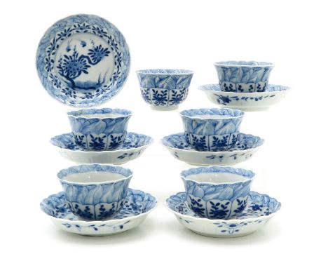Floral decor, marked with double ring and flower, saucers are 13 cm. in diameter, small chips on edges.