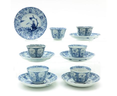 Blue and white decor depicting scene with Chinese man in garden, 18th Century, Kylin decor on border of saucers, saucers are 