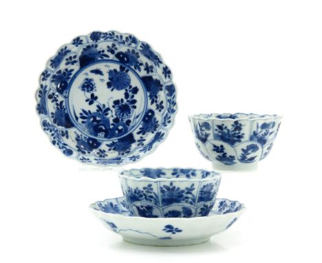 Scalloped edge floral decor, saucers are 13 cm. in diameter, light fritting on edge.