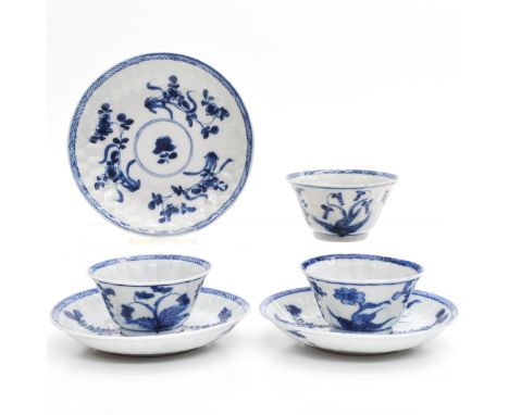 Floral decor, marked with flower on bottom, saucers are 11 cm. in diameter. 