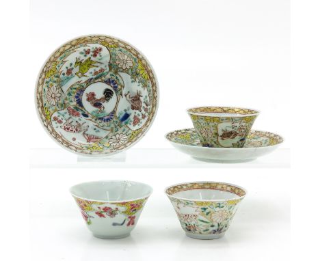 Including three cups and two saucers, decorated in Famille Rose enamels with gilt and yellow accents with roosters, deer, and