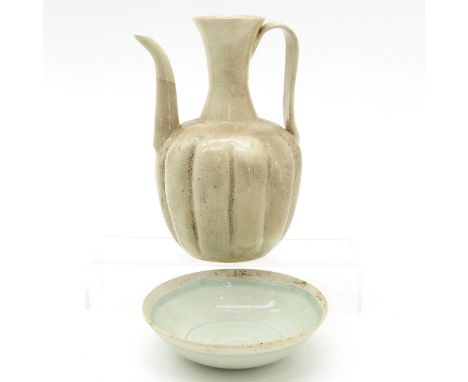 In cream glaze and celadon decors, bowl is 15 cm. in diameter and pitcher is 22 cm. tall. 