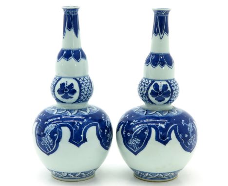 Blue and white decor, marked with double ring on bottom, 22 cm. tall.