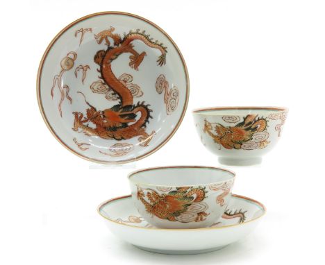 Decorated with dragons and clouds, saucers are 13 cm. in diameter.