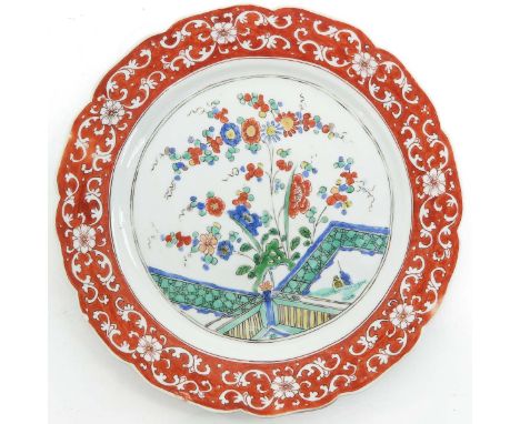 Famille Verte enamels depicting scene in garden with flowers, border in orange ground with white floral decor, marked with do