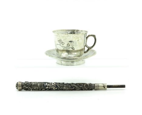 Including engraved cup and saucer and umbrella handle 22 cm. long.