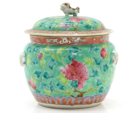 Light green ground decorated with florals in Famille Rose enamels, 12 cm. in diameter, with hairline.