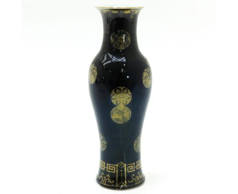 Black ground with gilt decor of flowers, marked on bottom with double ring, 30 cm. tall. 