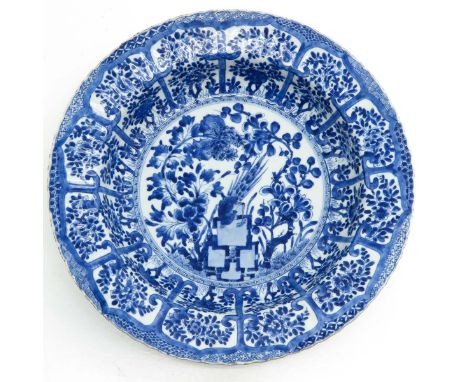 Floral garden and bird decor, marked with double ring and flowers on back, 18th Century, 35 cm. in diameter, chip and hairlin