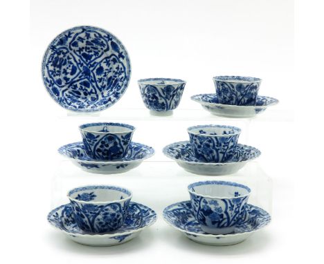Floral decor, marked on bottom with double ring and flower, 18th Century, saucers are 12 cm. in diameter, some with chip and 