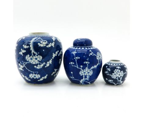 Dark blue ground with white flower blossom decor, two marked with double ring, tallest jar is 22 cm. in diverse conditions.