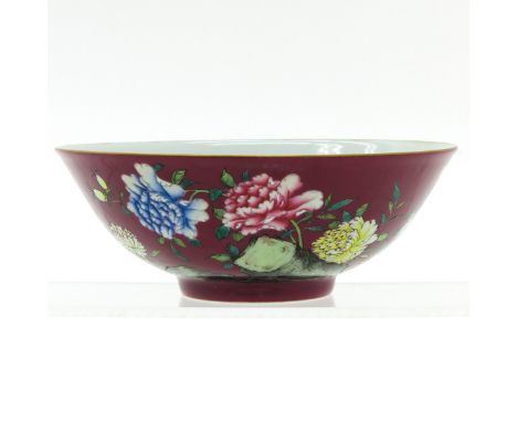 Ruby ground with florals in Famille Rose enamels, Yongzheng mark, 15 cm. in diameter.