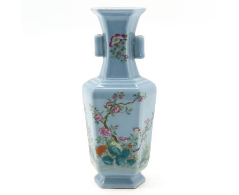 Light blue ground with florals in Famille Rose enamels, Qianlong Mark, 30 cm. tall. 