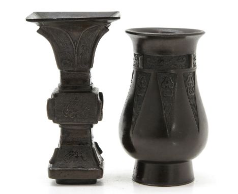 Candlestick is 15 cm. tall, Vase is decorated animals surrounding rim and 13 cm. tall. 