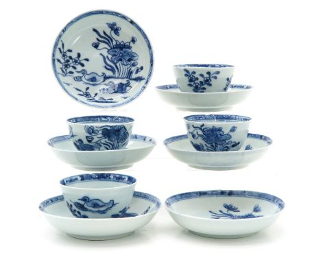 Including six saucers and four cups in blue and white floral decor with ducks, saucers are 12 cm. in diameter, some with chip