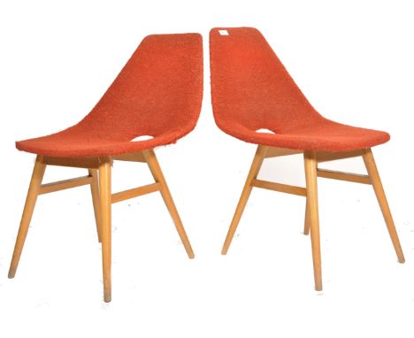 A pair of retro 1950's mid century dining chairs being raised on teak tapering legs with woollen&nbsp; upholstered shaped sea