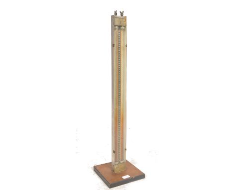 A mid century Industrial meter with mahogany base, metal uprightr with gauge and central phial. Tested 25psi believed to test