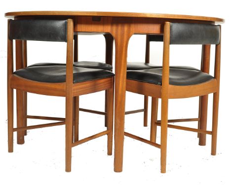 Mcintosh of Kirkcaldy - A retro 1970's teak wood extending dining table of round form raised on tapering legs having a fitted