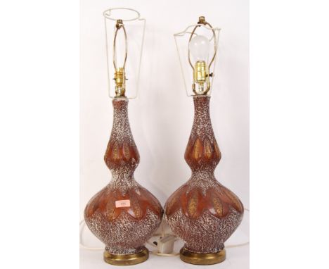 A pair of 1970's West German style ceramic table lamps - lights. Each of stoneglaze studio pottery form, baluster in shape co