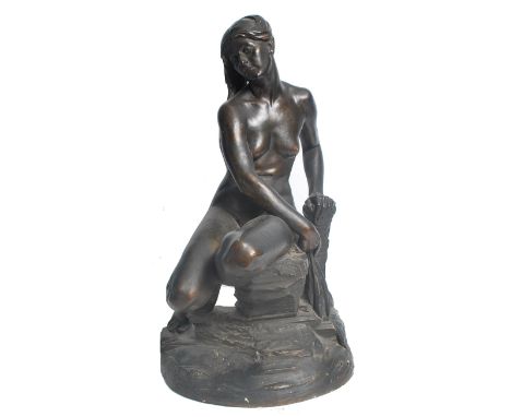 An early 20th century Art Deco plaster maquette figurine sculpture of a nude maiden set atop a naturalistic rock base. The fi