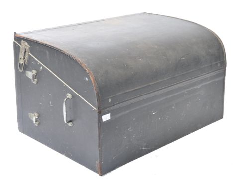 An early 20th century vintage car motoring hamper trunk. The shape black vinyl covered trunk with sloped body having reverse 