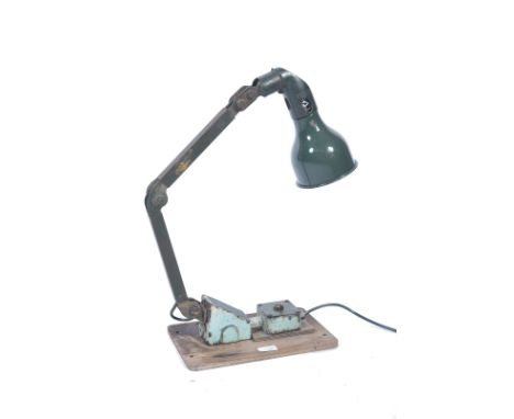 A vintage 20th century Industrial Memlite style anglepoise desk - wall mounted work lamp in original green paint with square 