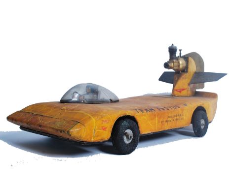 A fabulous 20th century vintage tether car of balsa wooden construction having partial engine in the manner of landspeed reco