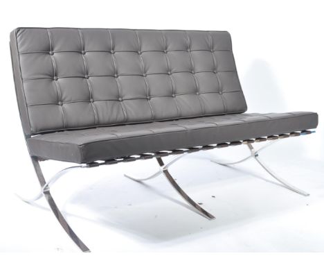 After Mies van der Rohe - A Barcelona type two seater settee / sofa. The design is formed from a chromed curved steel frame w