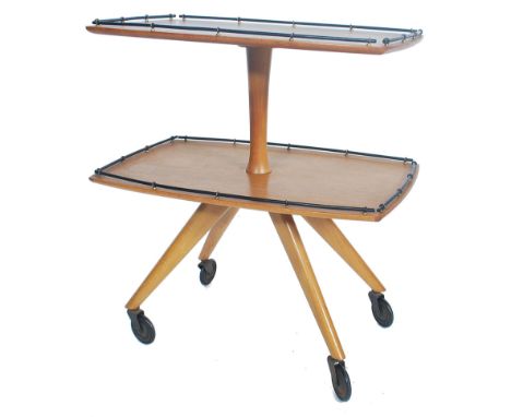 A vintage retro 20th century teak wood Danish influence metamorphic two tier display trolley raised on four angular legs with
