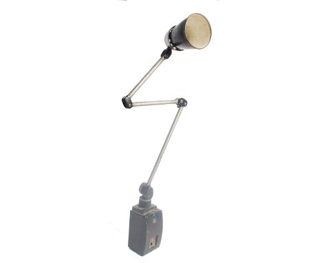 A vintage industrial lo-vo lite lamp for ' BHI ' in black and steel. The lamp having 4 pivot joints raised on a large black s