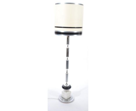 A retro style 20th century chrome and dice style standard lamp. Raised on terraced base with chrome upright complete with the