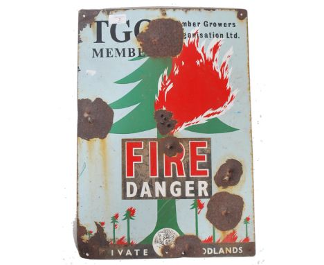 A vintage 20th century Industrial enamel Timbers Growers Organisation fire danger sign depicting a burning tree with notation