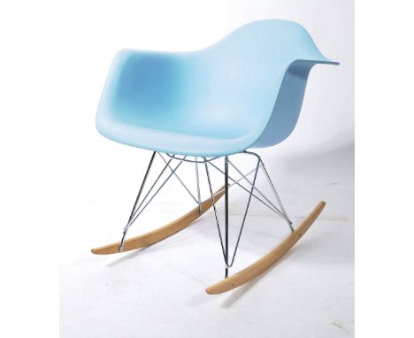 After Charles & Ray Eames - RAR rocking chair with a moulded baby blue seat, steel wire struts and birch runners. The origina